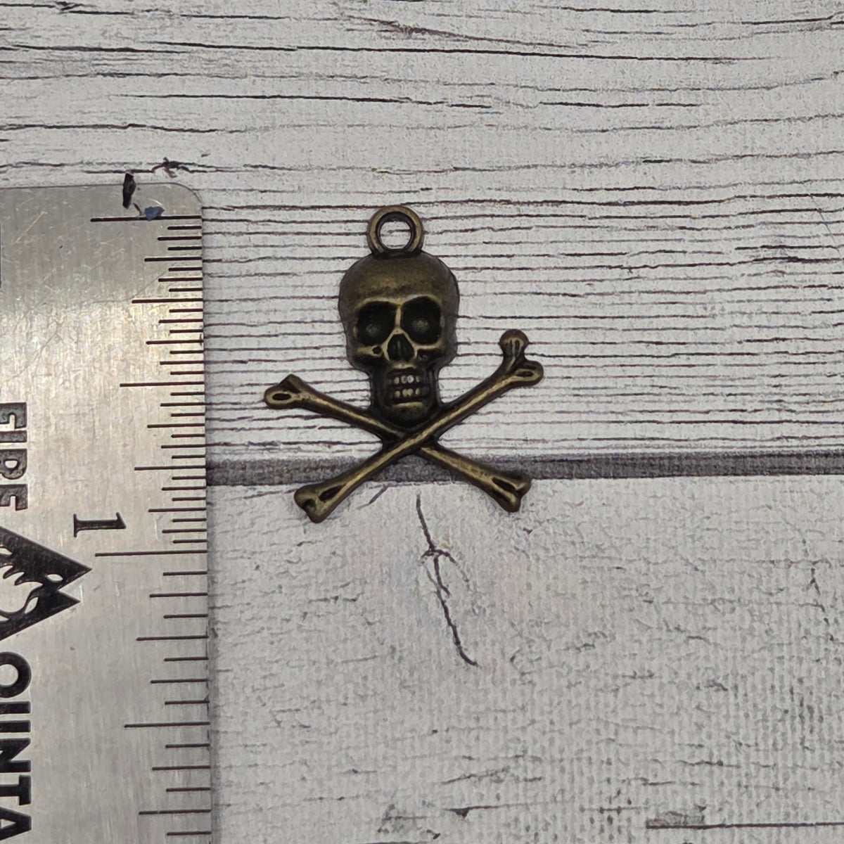 Bronze skull and crossbones - lot of 5