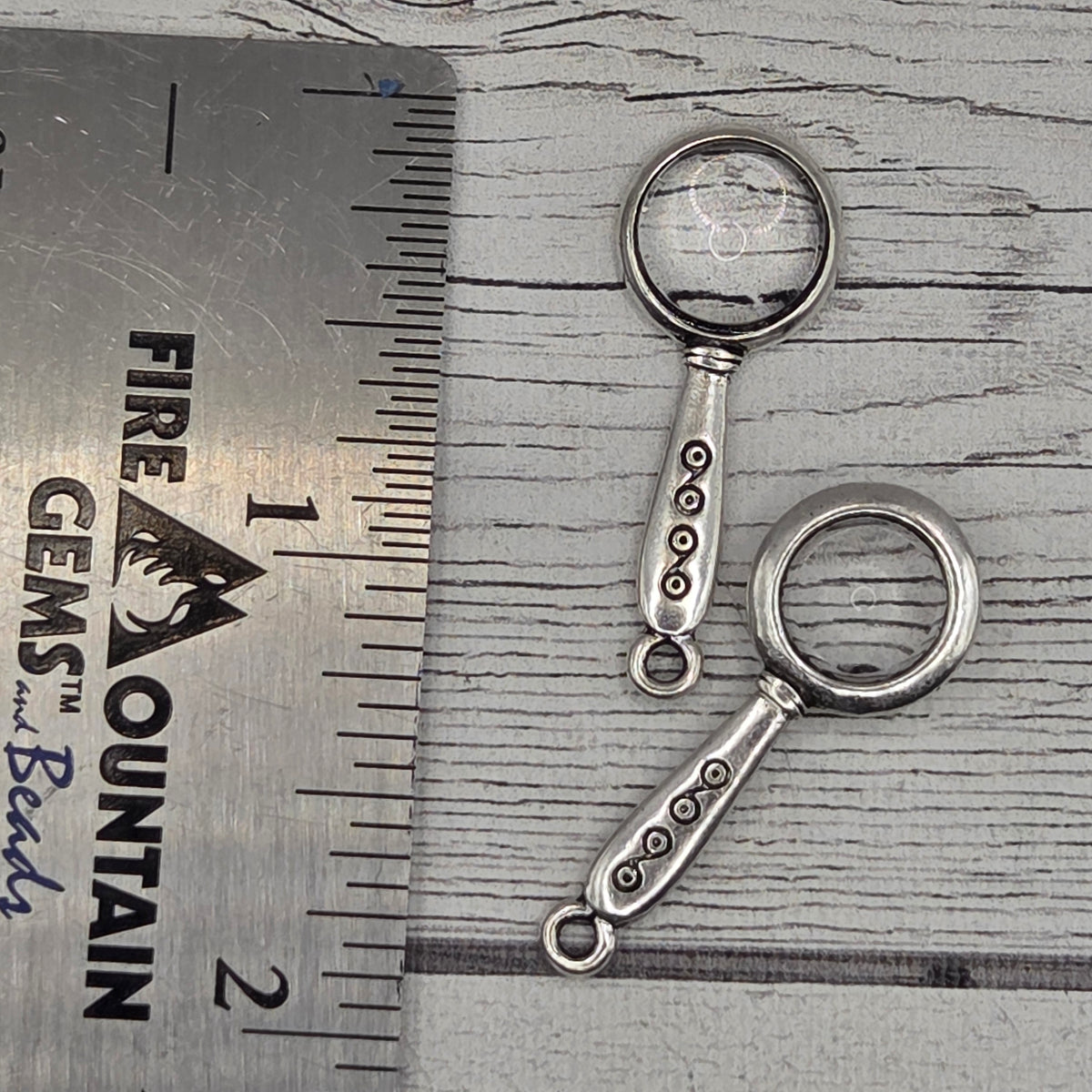 Magnifying glass charm