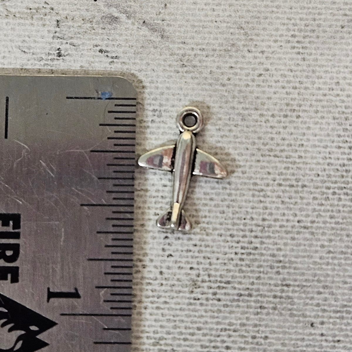 Tiny plane charm - lot of 10