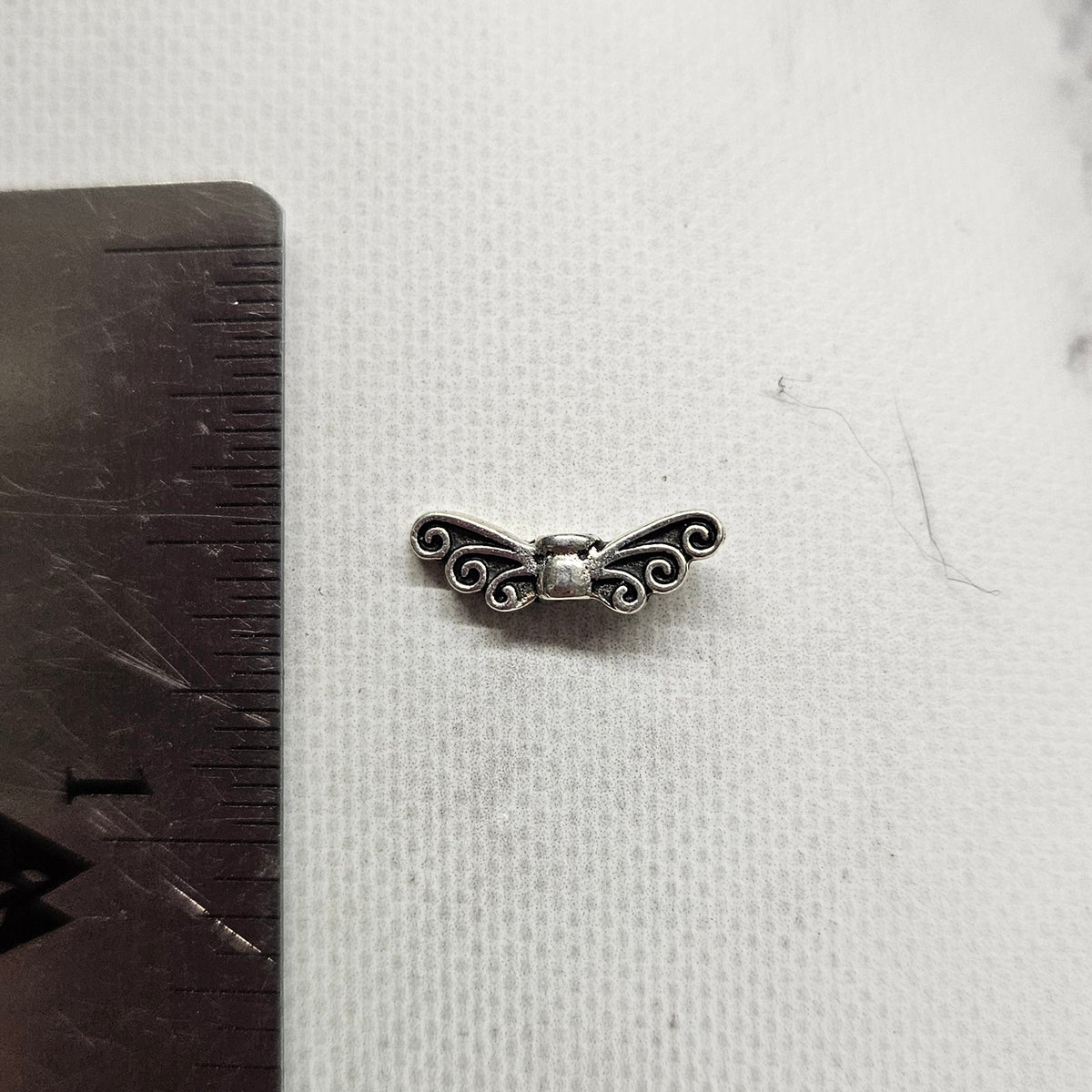 tiny Wing Bead charm silver toned - lot of 8