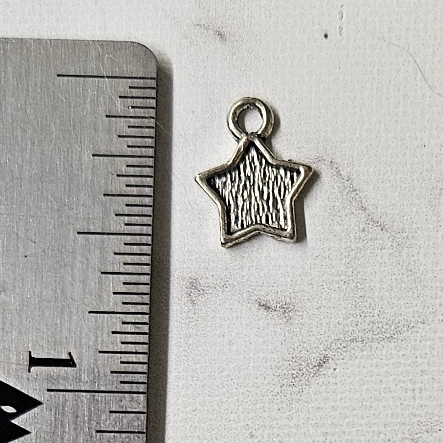 Flat star charm - lot of 12