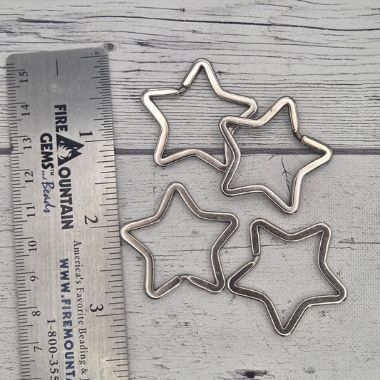 Silver star shaped split ring - lot of 5