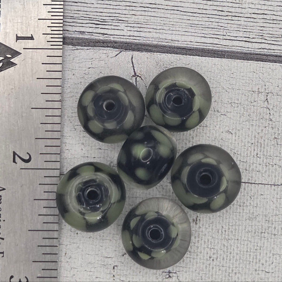 Lampwork glass beads - black with green dots