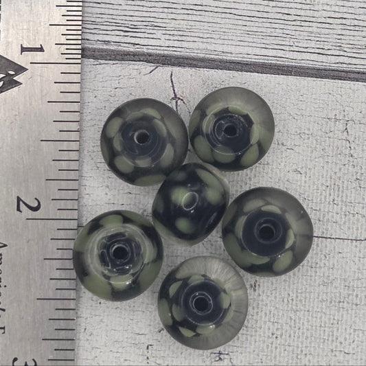 Lampwork glass beads - black with green dots