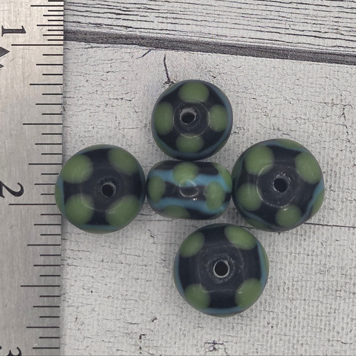 Lampwork glass beads - black with green dots and aqua